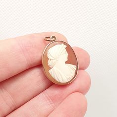 DESCRIPTION: A beautiful antique Victorian solid 9ct gold cameo pendant. The cameo is genuine shell and has been intricately hand carved. It weighs approx. 3.46g and the size dimensions are in the later photos. As to be expected with its age, the gold isn't stamped/hallmarked, it tests for solid 9ct gold. Mountains of unique antique and vintage pieces in our shop!  **FREE worldwide shipping on all items. Fill your boots **Plenty of experience. Everything guaranteed and authentic **Returns accept Antique Cameo Oval Cabochon Jewelry, Antique Rose Gold Cameo Jewelry, Rope Border, Victorian Pendants, Jewelry Post, Carved Shell, Cameo Necklace, Cameo Pendant, Unique Antiques