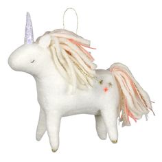 a white unicorn ornament with pink manes