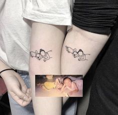 two people with matching tattoos on their arms