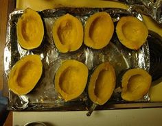 peeled squash on aluminum foil sitting on top of a counter