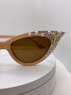 Tan cateye Swarovski rhinestone pearl bow sunglasses Elegant Gold Cat Eye Sunglasses For Evening, Glamorous Gold Sunglasses For Party, Glamorous Gold Party Sunglasses, Elegant Cat Eye Sunglasses For Summer Party, Party Gold Sunglasses With Rhinestones, Glamorous Cat Eye Sunglasses For Party, Elegant Summer Wedding Sunglasses, Pearl Bow, Clear Rhinestones