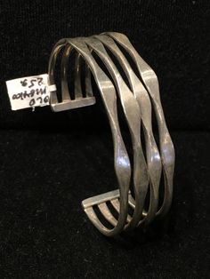 "Old Mexican Sterling Silver abstract modern cuff bracelet with attractive MCM style sculptural positive space-negative space design. Mexico & 925 stamps, plus another one I can't make out, possibly the hallmark of the maker? .75\" wide 5 1/8\" interior circumference plus 1 3/8\" flexible gap 25g 507R - This stunning piece is coming from an exciting relationship with a well known & popular Santa Fe, NM, jewelry gallery. I will be listing many exquisite pieces, some at lower prices than t Luxury Modernist Jewelry Stamped 925, Luxury Modernist Sterling Silver Bracelets, Luxury Modernist Sterling Silver Formal Bracelet, Contemporary Formal Cuff Bracelet Bangle, Modern Adjustable Sterling Silver Bangle Bracelet, Modern Adjustable Sterling Silver Bangle, Modern Adjustable Cuff Bracelet For Formal Occasions, Modernist Cuff Bracelet With Polished Finish, Modernist Polished Cuff Bracelet