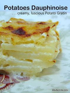 a close up of food on a plate with words above it that reads potatoes dauhnoise creamy, lucious potato gratin