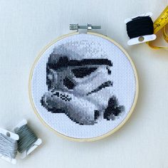 a star wars cross stitch pattern with scissors and thread