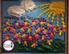 a bulletin board decorated with paper flowers and the words garden of letters written on it