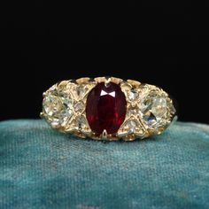 Beautiful Antique Victorian English 18K Gold Burma Ruby Diamond Three Stone Ring - GIA . This gorgeous antique Victorian English ruby and diamond ring is crafted in 18k yellow gold. The ring features a natural Burmese ruby that is unheated in the center and comes with a Lotus Gem report. The sides are gorgeous old European cut diamonds that come with a GIA report. The ring has small rose cuts in between the diamond and ruby and is in great condition. Item #R1994 Metal: 18K Yellow Gold Weight: 3.4 Grams  Size: 8 1/2 Ruby: 1.07 ct - Burma / NO HEAT -  Lotus # 5564-1786  Side Diamond: .82 ct - GIA # 2231197271 Color: S - T Clarity: VS2 Side Diamond: .77 ct - GIA # 2231197275 Color: S - T Clarity: SI2 Measurements: Top of the ring measures 9.33 mm wide and band measures 2.84 mm wide. Measureme Ceremonial Yellow Gold Diamond Ring, Luxury Ruby Diamond Ring With Rose Cut Diamonds, Gold Ruby Ring With 17 Jewels For Wedding, Victorian Yellow Gold Rings With Rose Cut Diamonds, Antique Ruby Ring With Single Cut Diamonds, Gold Marquise Ruby Ring With Diamonds, Gold Marquise Gemstone Wedding Jewelry, Luxury Marquise Cut Yellow Gold Ruby Ring, Luxury Yellow Gold Ruby Ring With Marquise Cut