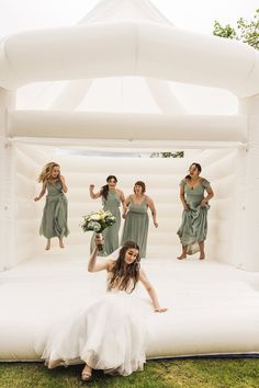 a bride and her bridal party in an inflatable bed