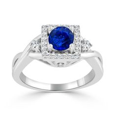 a white gold ring with a blue sapphire and diamonds on the sides, set against a white background