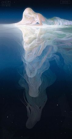 a woman is floating in the water with her hair blowing