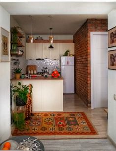 the kitchen is clean and ready to be used as a living room or dining area