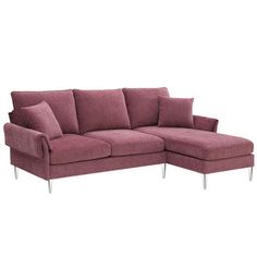 a pink sectional sofa with pillows on the top and bottom, sitting in front of a white background