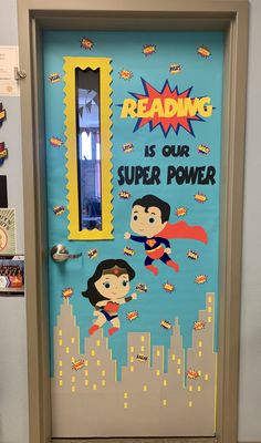 this door is decorated to look like superman and wonder woman