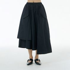 Versatile Black Asymmetrical Skirt, Black Asymmetrical Hem Skirt For Work, Chic Asymmetrical Skirt With Pockets, Black Bottoms With Asymmetrical Hem For Spring, Spring Workwear Skirt With High-low Hem, Black Asymmetrical Hem Skirt For Summer, Spring Black Irregular Bottoms, Spring Skirt With Asymmetrical Hem And Pockets, Summer Workwear Bottoms With High-low Hem