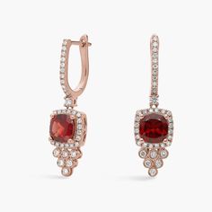 Crafted from luxurious 14k rose gold, these drop earrings feature rich red garnet stones dangling gracefully. A shimmering cascade of drop diamonds completes the elegant effect. Precious Gemstones Jewelry, Garnet Stone, Diamond Drop Earrings, Diamond Drops, Red Garnet, Cushion Cut, Semi Precious Gemstones, Gemstone Earrings, Garnet