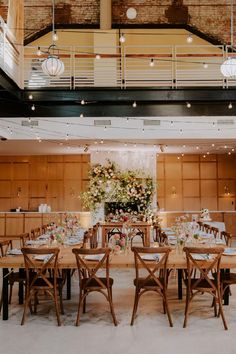 a large room with tables and chairs in it