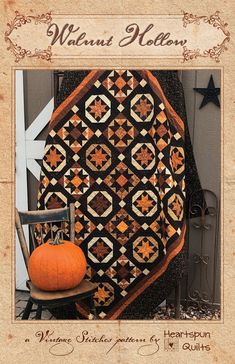 an old fashioned quilt with a pumpkin on it