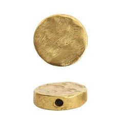 an object that looks like a gold disc with a hole in the middle and one piece missing