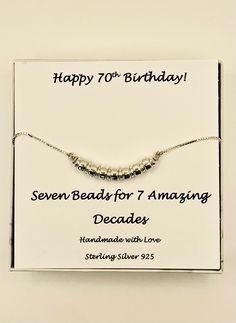 "70th Birthday Gift For Women, 70th Bday gift Sterling Silver Bead Bracelet, gift for grandmother decades bracelet decade jewelry 7 rings  ❤ 100% Sterling Silver , all components.   High quality,  highly polished 7 sterling silver beads representing the 7 fabulous decades in style.  ❤ Adjustable chain makes it easy to take on and off.   2 sizes are available small/medium (5.5\" - 9\") or medium/large 6\"-10\") ❤ Beautifully gift wrapped at no extra charge, ready for gift giving.  ❤  You can further personalize by adding a Swarovski crystal birthstone charm of the recipients birth month from here: https://www.etsy.com/listing/262916892/add-a-swarovski-crystal-birthstone-to?click_key=71b23580c648b3c78bf387244c82c712e76a9678%3A262916892&click_sum=f4acd9c2&ga_search_query=add%2Bon&ref=shop_ite Silver Necklaces With Round Beads For Birthdays, Silver Necklaces With Round Beads For Birthday, Mother's Day Anniversary Beaded Bracelets With Round Beads, Anniversary Silver Beaded Bracelets, Mother's Day Anniversary Round Beaded Bracelets, Round Beaded Bracelets For Mother's Day Anniversary, Sterling Silver Beaded Bracelets For Anniversary, 70th Birthday Card, Gift For Grandmother