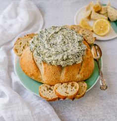 a plate with bread and spinach dip on it