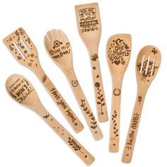 six wooden spoons with designs on them and forks in the shape of utensils