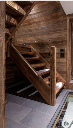 there is a wooden staircase in the room