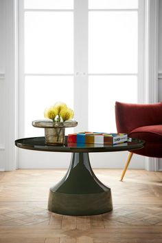 a glass table with some flowers on it