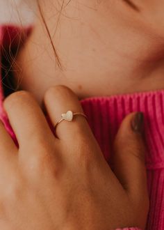 A tiny heart soldered onto our daintiest band, making it a perfect ring to add to any stack. 🤟🏼 Heart-shaped pendant is attached to 1mm wide band. Available in 14kt Gold Fill + Sterling Silver. Olivia stacks with our Confetti Ring and Revolve Ring. Handmade in Eau Claire, WI. Our jewelry is handmade so each piece will be unique and may vary slightly from what is pictured. Dainty Tiny Jewelry For Everyday Wear, Dainty Tiny Jewelry For Everyday, Dainty Stackable Rings In Recycled Gold As A Gift, Dainty Stackable Rings In Recycled Gold For Gifts, Dainty Recycled Gold Stackable Rings Gift, Dainty Stackable Rings In Recycled Gold, Dainty Stackable Rings As Gift, Dainty Stackable Rings Gift, Dainty Adjustable Tiny Heart Ring