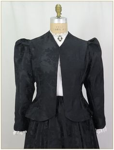 "Poly Jacquard. Color: Black. Beautiful woven jacquard satin fabric in rose pattern design. Fitting darts front and back and shoulder pleated Victorian two piece sleeves. Unlined jacket perfect for outdoor wear in all weather. Matching satin jacquard skirt and belt sold separately. Dry clean. Circa 1890-1905. Made in U.S.A. Sizes: SM, MED LG & XLG. Jackets ordered by bust measurement, inches: BUST         SIZES 32\" - 34\"   SMALL 35\" - 39\"   MEDIUM 40\" - 44\"   LARGE 45\" - 49\"   XLARGE Jac Rose Pattern Design, Victorian Jacket, Unlined Jacket, Satin Noir, Jacquard Skirt, Jacquard Jacket, Women Overcoat, Evening Jackets, Satin Jackets