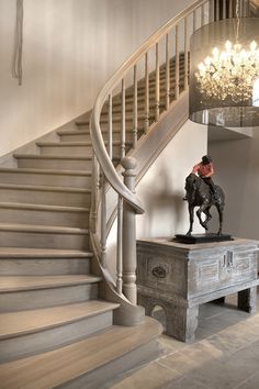 the stairs in this house are made from wood and have been painted white with black accents