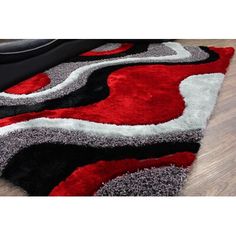 a red and black area rug on the floor