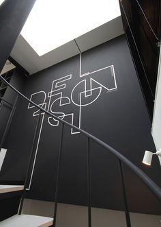 the staircase is painted black and white with an artistic design on it's side