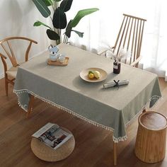 a dining room table with a plate of fruit on it