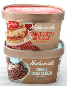 three ice cream containers stacked on top of each other with chocolate and vanilla toppings