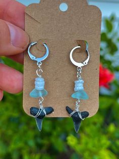 Handmade with real and authentic fossilized shark teeth, these gemstones dangle earrings can add a beachy and trendy look for any occasion. You have your choice of gemstone color including rose quartz, malachite, aventurine, or jasper. You also have a choice of silver or gold accents to make your wiring and earring clasp. Each shark tooth is meticulously handcrafted onto the earrings, featuring genuine shark teeth that were personally discovered on the Northern Florida beaches, joined with rock Shark Tooth Jewelry, Beachy Jewlery, Shark Tooth Earrings, Shark Teeth Jewelry, Cool Sharks, Clasp Earrings, Shell Ideas, Northern Florida, Wishlist Ideas