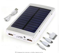 the solar power bank is plugged into an external charger with two usb cables