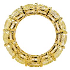 Eternity Band comprised of 13 GIA-Certified Cushion-Cut Fancy Light Yellow Diamonds on an 18 Karat Yellow Gold Band. 13.21 carats of Natural Fancy Light Yellow Diamonds from Scarselli form an elegant eternity band, fashioned with 18K yellow gold. Ring is resizable upon request. A clean, classic eternity band from Scarselli Diamonds. It offers a very timeless look that fits into the current trend of stackable rings. Symbolizing a commitment to love, eternity bands are usually given as a gift to c Light Yellow Diamond, Fancy Light, Yellow Diamonds, Fancy Lights, Diamond Eternity Band, Eternity Band Diamond, Diamond Eternity, Fancy Color Diamonds, Eternity Band