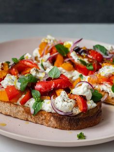 a piece of bread topped with vegetables and cheese