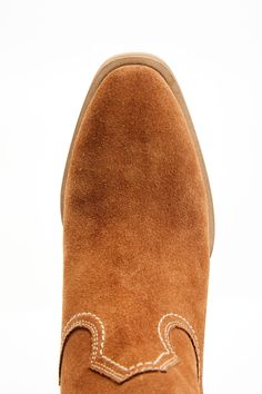 Genuine leather Brown suede with side fringe detailing Round bronze studded accents on scallop Round toe Side zip closure Leather outsole with rubber heel cap Stacked western heel Handcrafted by highly skilled boot artisans Imported Cushioned footbed Brown Suede-lined Boots For Rodeo, Western Boots With Almond Toe And Suede Lining, Western Suede Boots With Suede Lining, Western Style Brown Suede Boots, Brown Suede Boots For Ranch, Western Suede Chelsea Boots With Round Toe, Western Style Suede Moc Toe Boots, Suede Pointed Toe Boots For Ranch, Suede Boots With Pointed Toe For Ranch