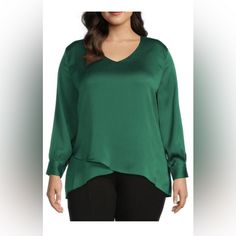 Calessa Size Xl Satin V-Neck Long Sleeve Crossover Hem Blouse Emerald. New With Tag From Calessa This Blouse Features: Textured Satin Fabrication V-Neckline Long Sleeves With Button Cuffs Crossover Hemline Pullover Construction Approx. 27.5" Front, 30" Back Lengths; " 24.5" Pit To Pit Laid Flat 97% Polyester, 3% Spandex Hand Wash Versatile V-neck Blouse For Night Out, Chic V-neck Blouse For Layering, V-neck Blouse For Layering, Green V-neck Top For Night Out, Solid V-neck Blouse For Layering, Chic V-neck Top For Layering, Green V-neck Tops For Layering, Elegant Green Tops For Layering, White Sleeveless Shirt