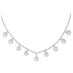 Exquisite dangling round brilliant diamond necklace. High jewelry by Alexander Beverly Hills. 12.76 carats total diamond weight. 9 round brilliant diamonds 4.56ct. 344 round diamonds, 8.20 carats. Approximately G/H color and SI clarity. Prong set in 18k white gold, 16in. Accommodated with an up-to-date digital appraisal by a GIA G.G. once purchased, upon request. Please contact us with any questions. Thank you. Item Number N6169 Diamond High Jewelry, High Jewelry Necklace, Modern Diamond Jewelry, White Diamond Jewelry, Modern Necklaces, Handcrafted Necklace, Drop Necklace, Brilliant Diamond, Pretty Jewellery