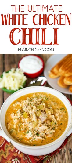 the ultimate white chicken chili in a bowl with bread and sour cream on the side