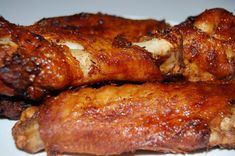 closeup of chicken wings on a white plate