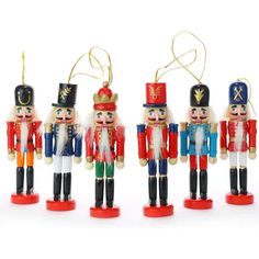 four wooden nutcrackers are lined up together