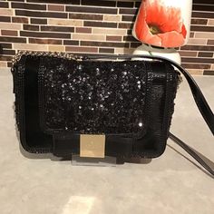 Kate Spade New York Pure Fashion Elegance All Over Sequins With A Shiny Patent Leather Border Black Patent Bow With High Polish Gold Logo Engraved Front Plate 24" Strap A Great Crossbody Or Simply Tuck In Strap To Wear As Evening Clutch. Signature Polka Dot Lined Black & White. Inner Cell Phone Or Id Slot Black Sequin Convertible Crossbody Clutch Patent Leather Holiday Bag. Bag Width 9 In Shape Rectangle Closure Magnetic, Snap Handle/Strap Color Black Gold Occasion Party/Cocktail, Formal, Weddin Rectangular Shoulder Bag With Sequins For Night Out, Rectangular Sequin Shoulder Bag For Night Out, Chic Glitter Shoulder Bag For Evening, Chic Rectangular Sequined Shoulder Bag, Glamorous Evening Shoulder Bag With Sequins, Black Sequin Party Bag, Chic Sequined Shoulder Bag For Everyday Use, Chic Sequined Clutch Bag, Rectangular Sequin Evening Bag For Night Out