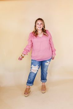 This Casually Stunning V Neck Long Sleeve Blouse brings effortless elegance to any wardrobe. Crafted in sheer fabric with a lining, this stylish blouse features a flattering V neckline and long sleeves with ruffle detail. The mauve pink hue makes it an eye-catching yet sophisticated style. Pair it with Judy Blue Jeans and sandals for a Spring season look! Arté is wearing a size small. Abby is wearing a size large. Size Measurements: Small: Bust: 20 inches across the front | Length: 25 inches Med Flowy Long Sleeve Chiffon Blouse, Pink Long Sleeve Blouse With Sheer Sleeves, Chiffon Blouse For Brunch In Fall, Fall Chiffon Blouse For Brunch, Chiffon Long Sleeve Blouse For Brunch, Chic Long Sleeve Chiffon Blouse, Sheer Long Sleeve Tops For Brunch, Long Sleeve Tops With Sheer Sleeves For Brunch, Flowy Long Sleeve Tops With Sheer Sleeves