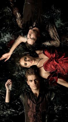 the twilight saga movie poster with two people laying on top of each other in water