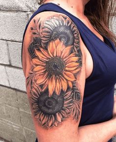 a woman with a sunflower tattoo on her arm