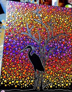 the painting is done with acrylic paint and has a black bird on it