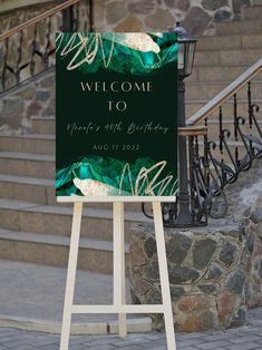 a welcome sign stands in front of some steps