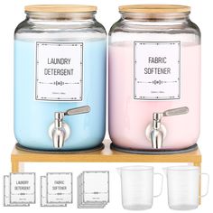 two jars with labels on them sitting next to each other, one blue and the other pink